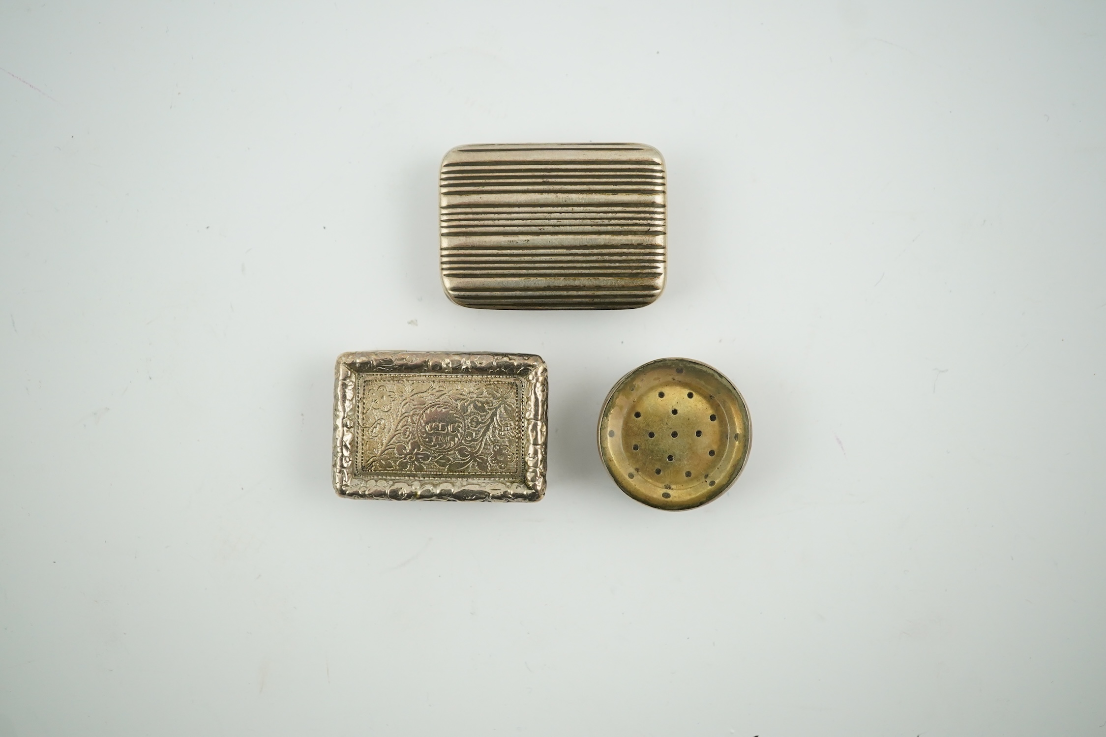 A William IV silver rectangular vinaigrette, William Stroud, Birmingham, 1833, 30mm and two other vinaigrettes. Condition - poor to fair